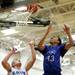 Pioneer senior Tevis Robinson jumps for a rebound in the game against Salem during the Chelsea High Basketball Tournament on Friday, Dec. 28. Daniel Brenner I AnnArbor.com